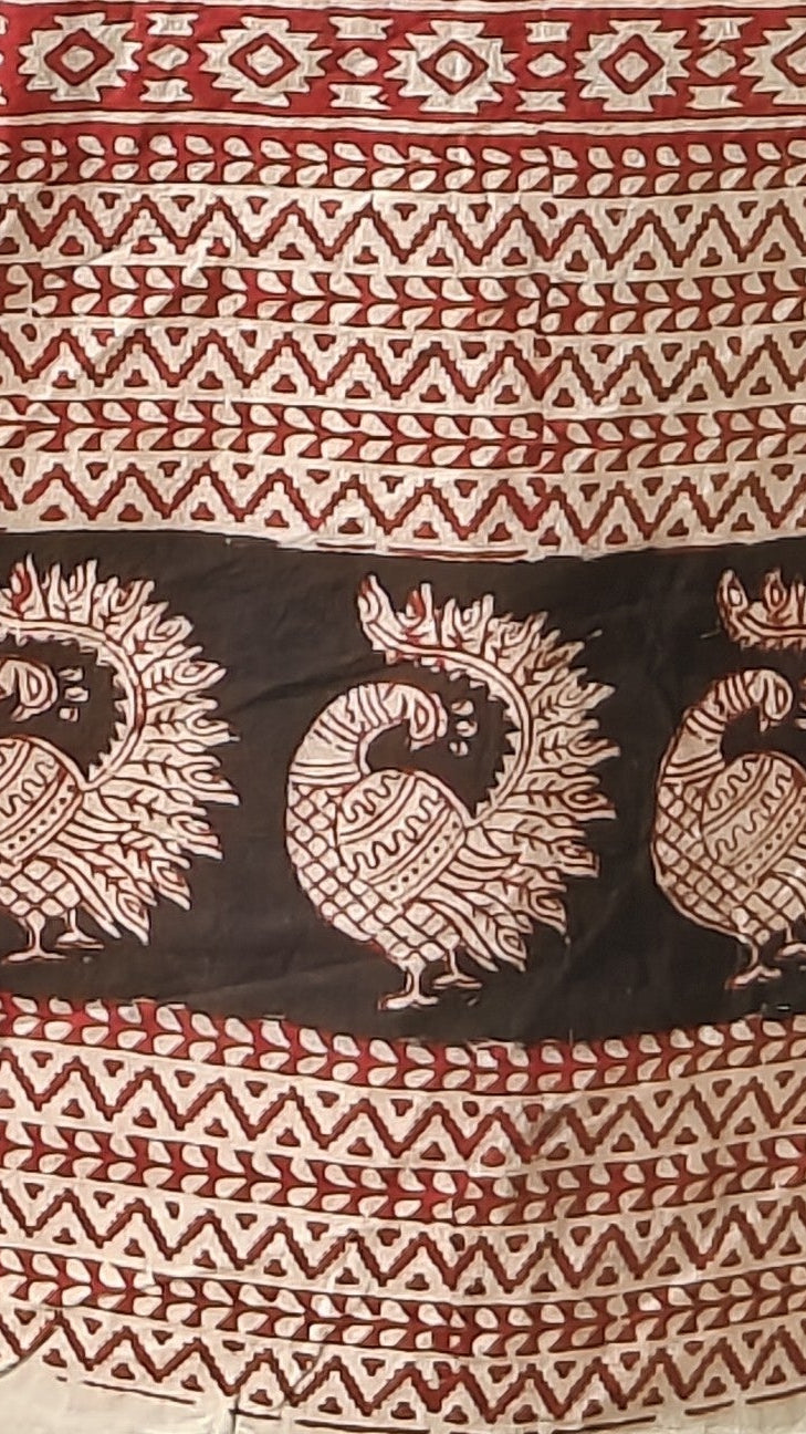 Handmade  Bagh Block with peacock patterns and geometric designs in red and black on a white background
