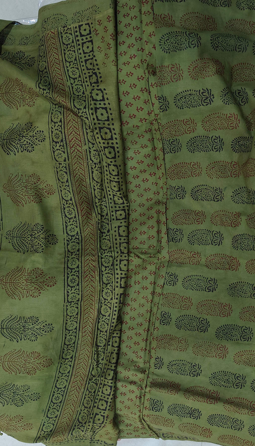 Traditional green Dhar Bagh hand block print unstitched suit set in pure cotton with handmade motifs and matching dupatta.