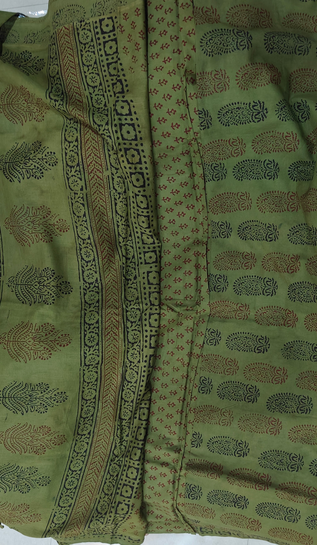 Traditional green Dhar Bagh hand block print unstitched suit set in pure cotton with handmade motifs and matching dupatta.