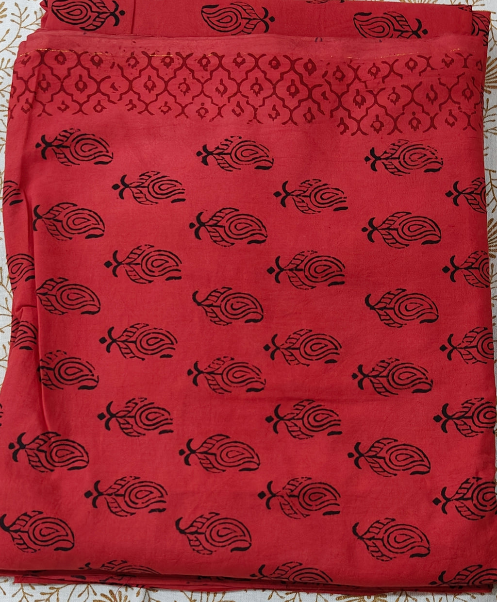 Traditional Dhar Bagh hand block print unstitched suit set in pure cotton, featuring intricate red and black handmade motifs with a matching dupatta