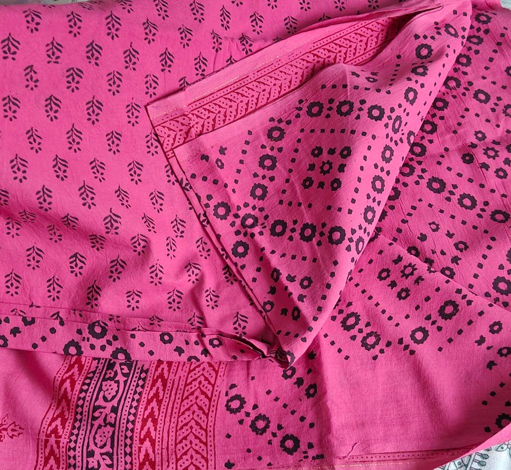 Traditional Dhar Bagh hand block print unstitched suit set in pure cotton featuring pink handmade motifs and a matching dupatta.