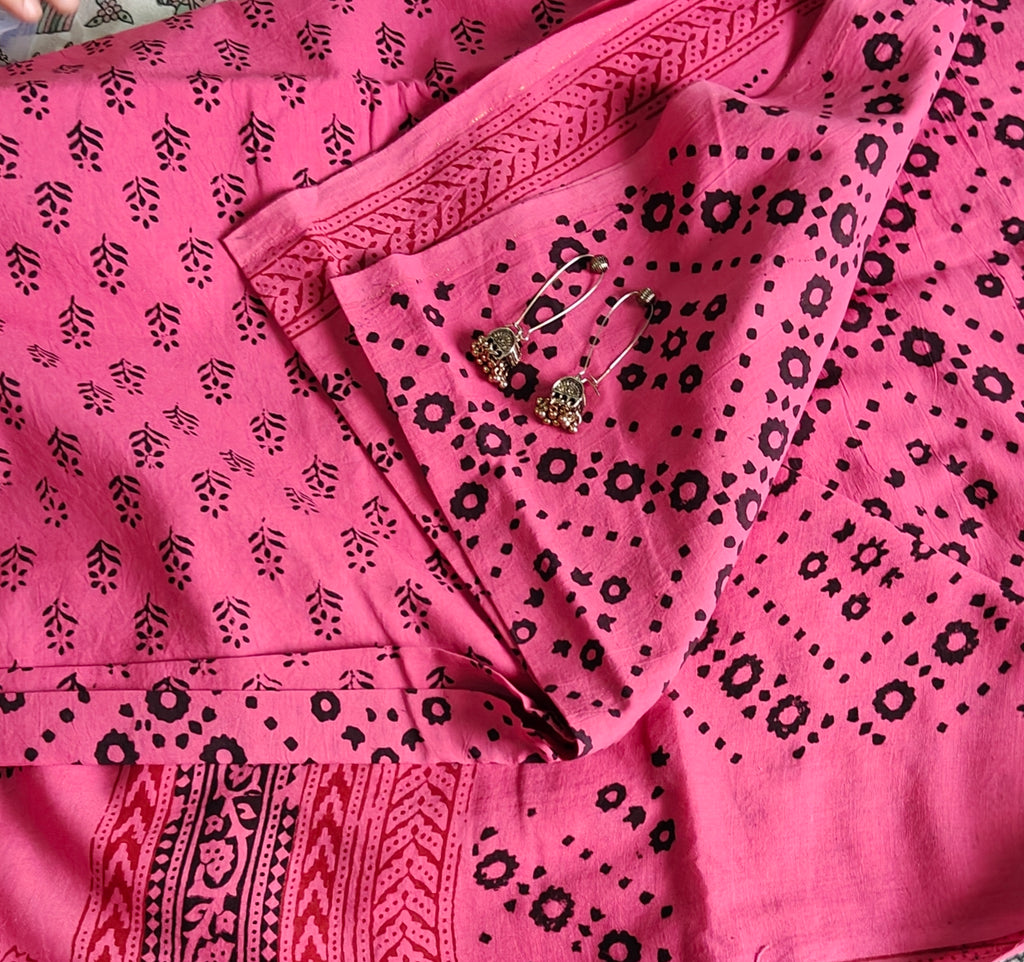 Traditional Dhar Bagh hand block print unstitched suit set in pure cotton featuring pink handmade motifs and a matching dupatta.