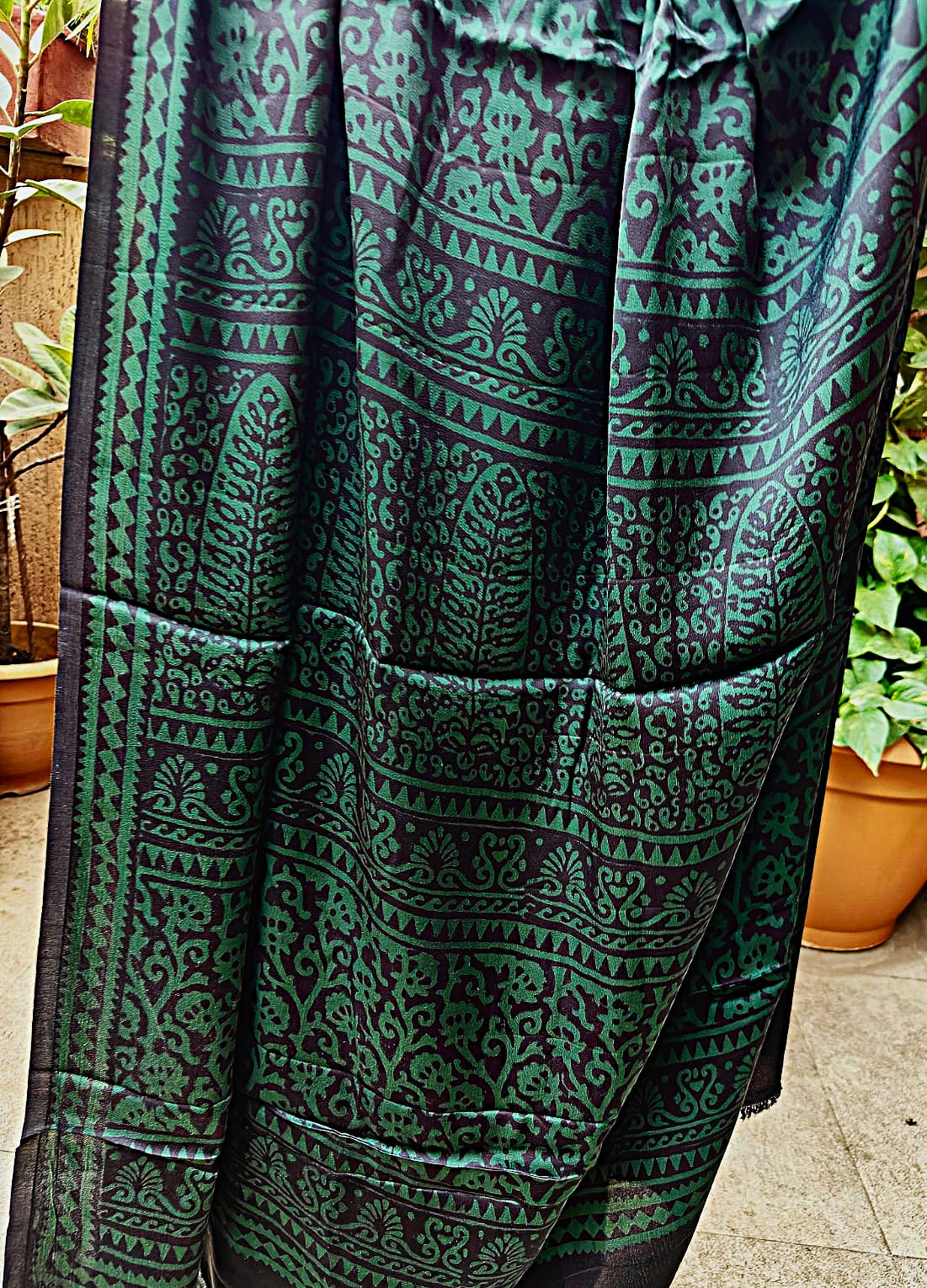 Intricately designed pallu of a handmade Bagh block print Green Modal silk saree featuring classic border patterns