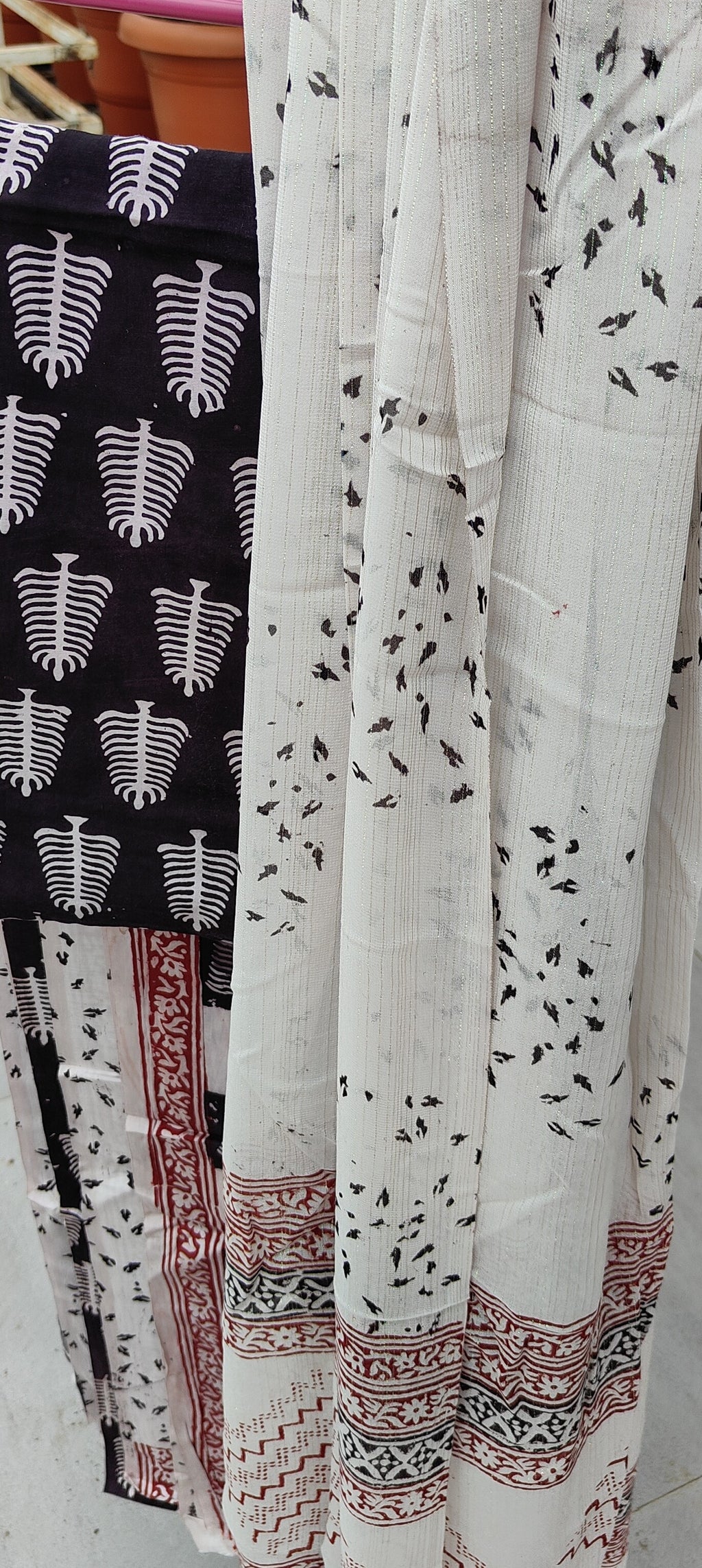 Artisan Made Dhar  White Bagh block print on black fine muslin unstitched suit with a contrast chiffon dupatta.