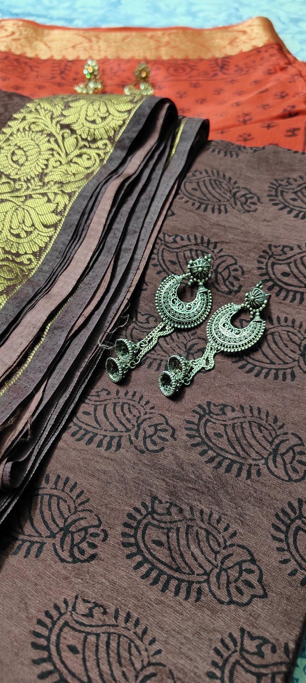 Sustainable luxury Dola silk saree featuring traditional handmade Bagh block prints in rich Mahogany and black