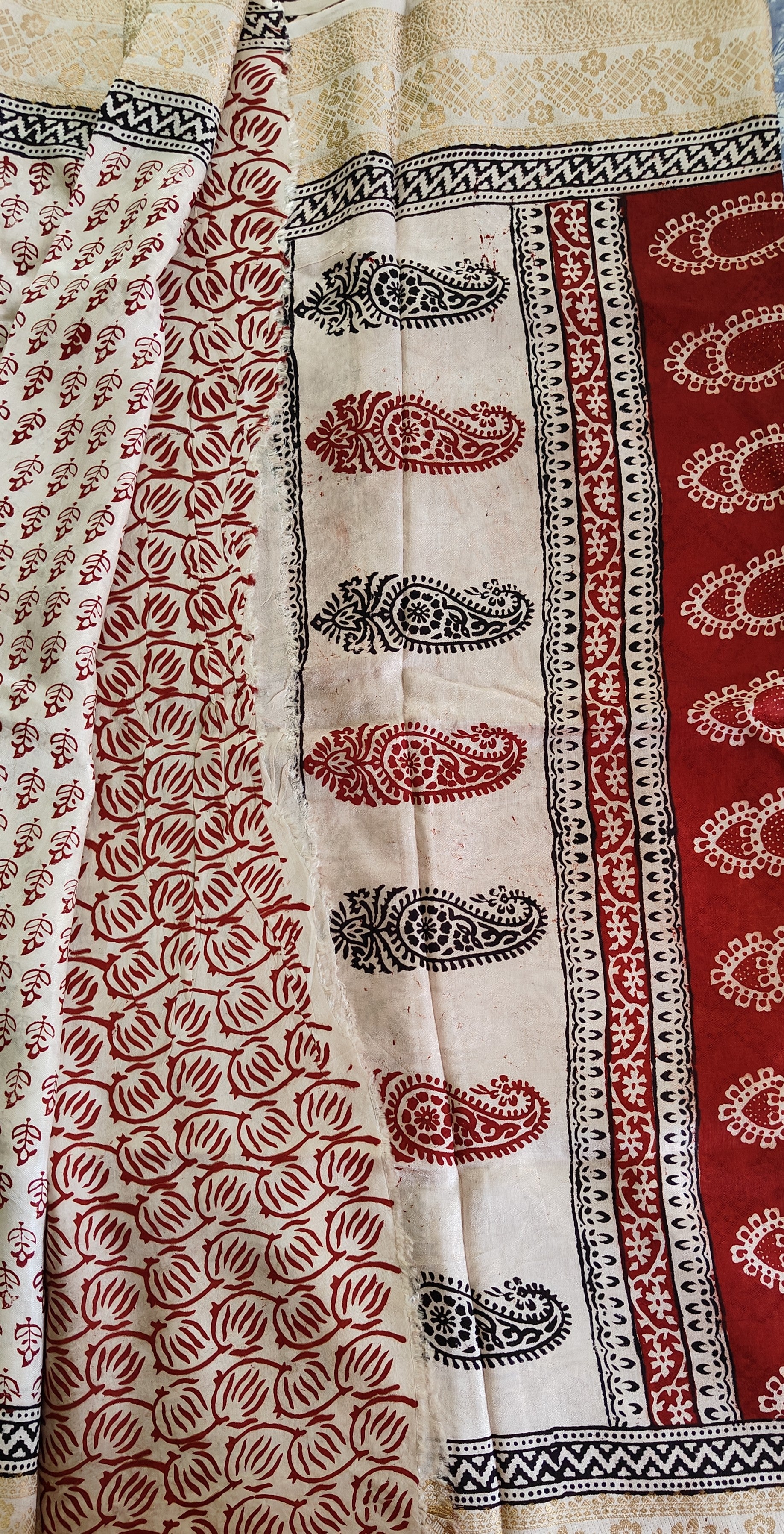 Artisan made wooden block prints on a Dola silk Saree, showcasing traditional Bagh floral motifs in Red and White with black ascent