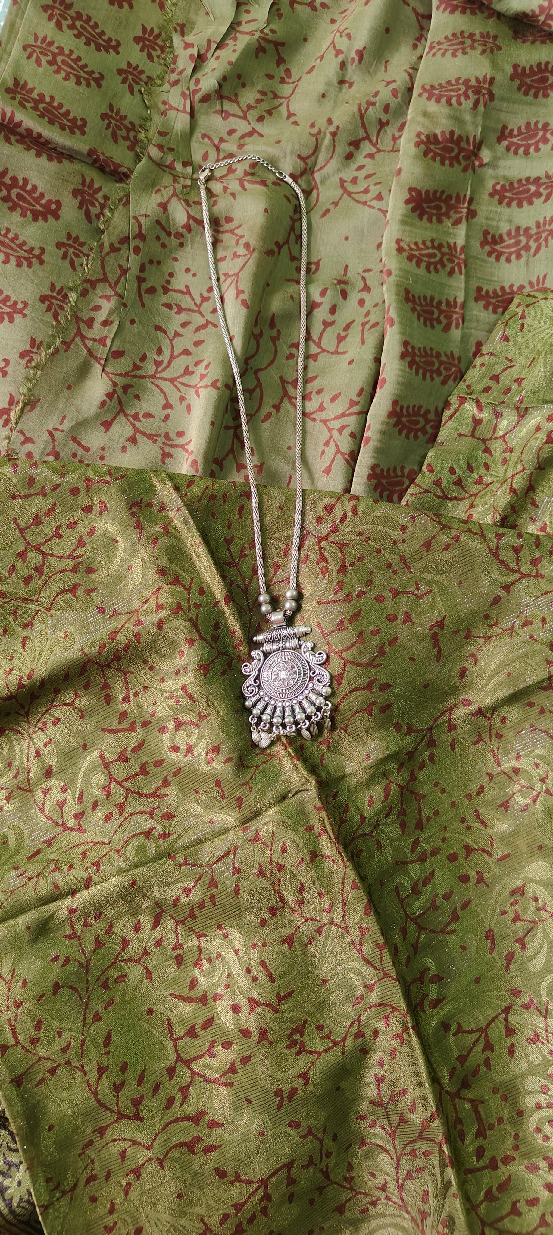 Authentic Dhar Bagh maroon block print on fine green muslin unstitched suit with a coordinating chiffon dupatta.