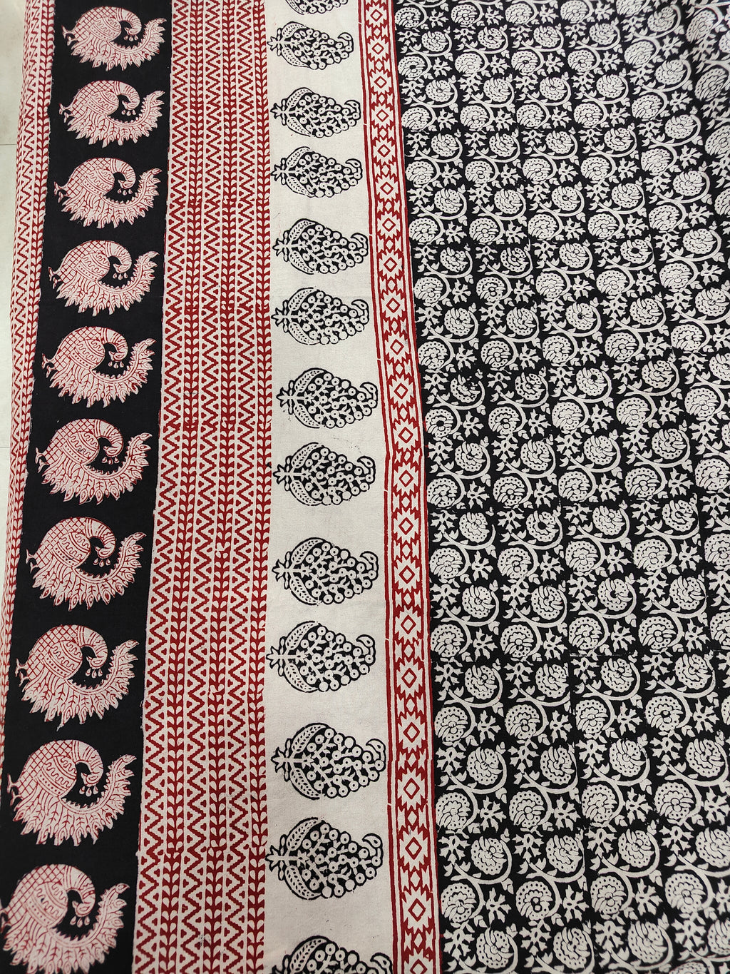 Set of handmade Bagh block print in traditional black, offwhite and madder red  creeper flower patterns with peacock shape bold border bedsheet with pillow covers.