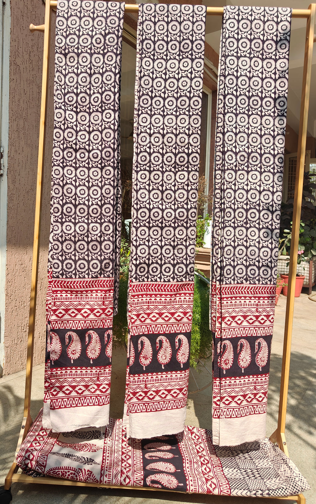 Handmade Bagh block print curtains in traditional black, white and madder red geometric patterns.