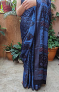 Sustainable luxury Modal silk saree featuring traditional handmade Bagh block prints in rich blue and black