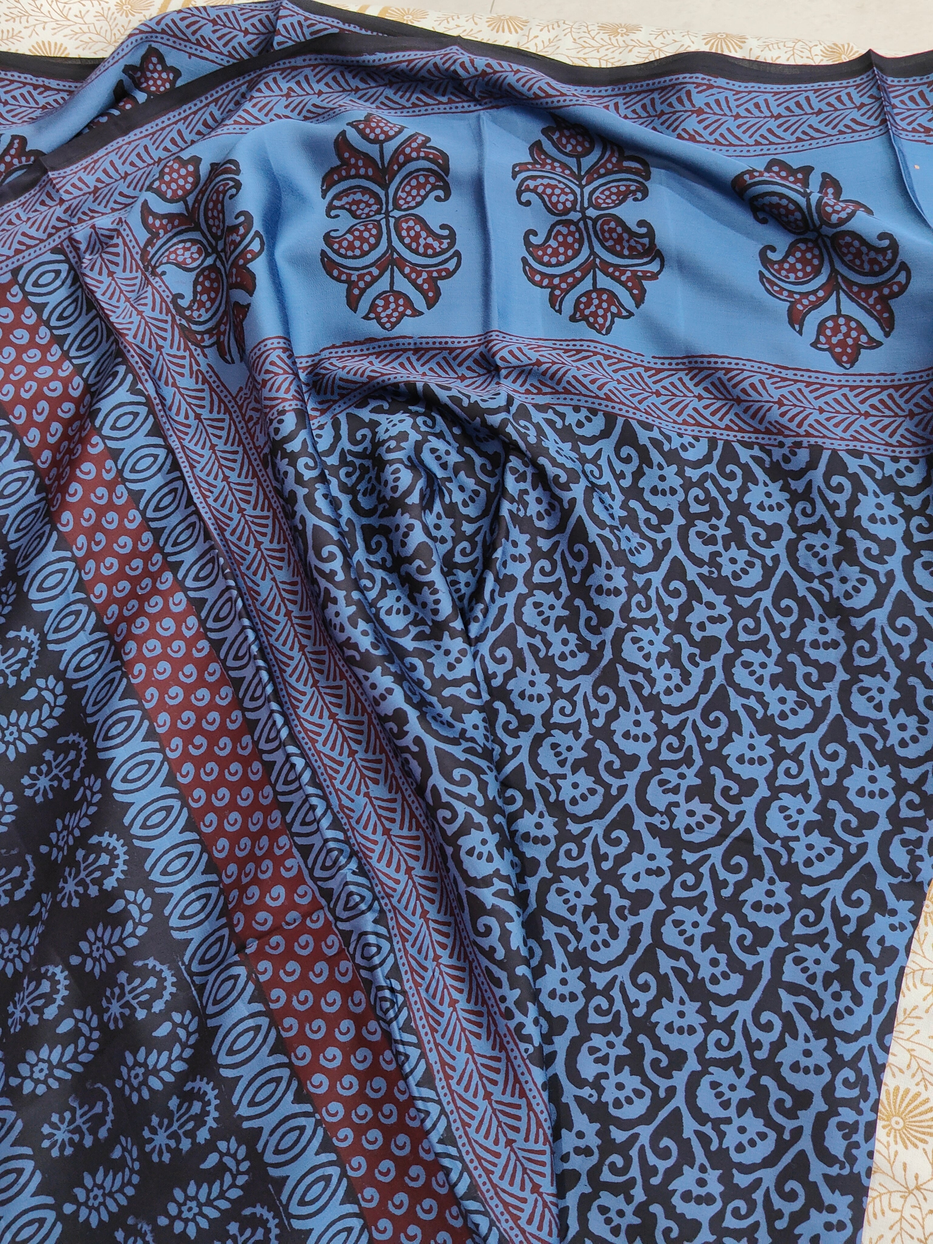 Sustainable luxury Modal silk saree featuring traditional handmade Bagh block prints in rich blue and black