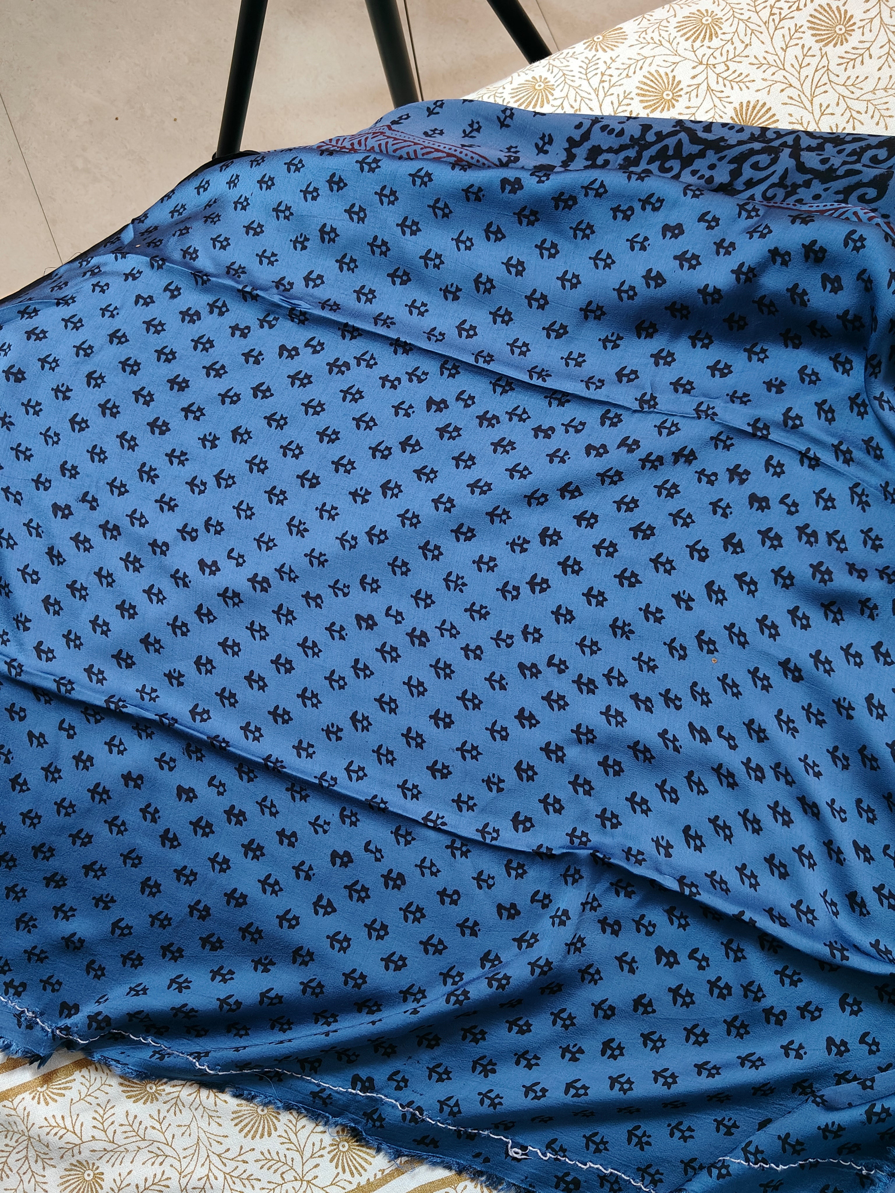 Sustainable luxury Modal silk saree featuring traditional handmade Bagh block prints in rich blue and black