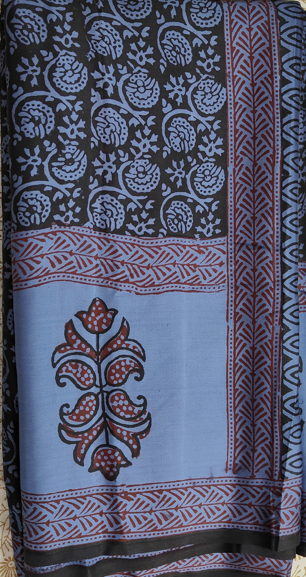 Sustainable luxury Modal silk saree featuring traditional handmade Bagh block prints in rich blue and black