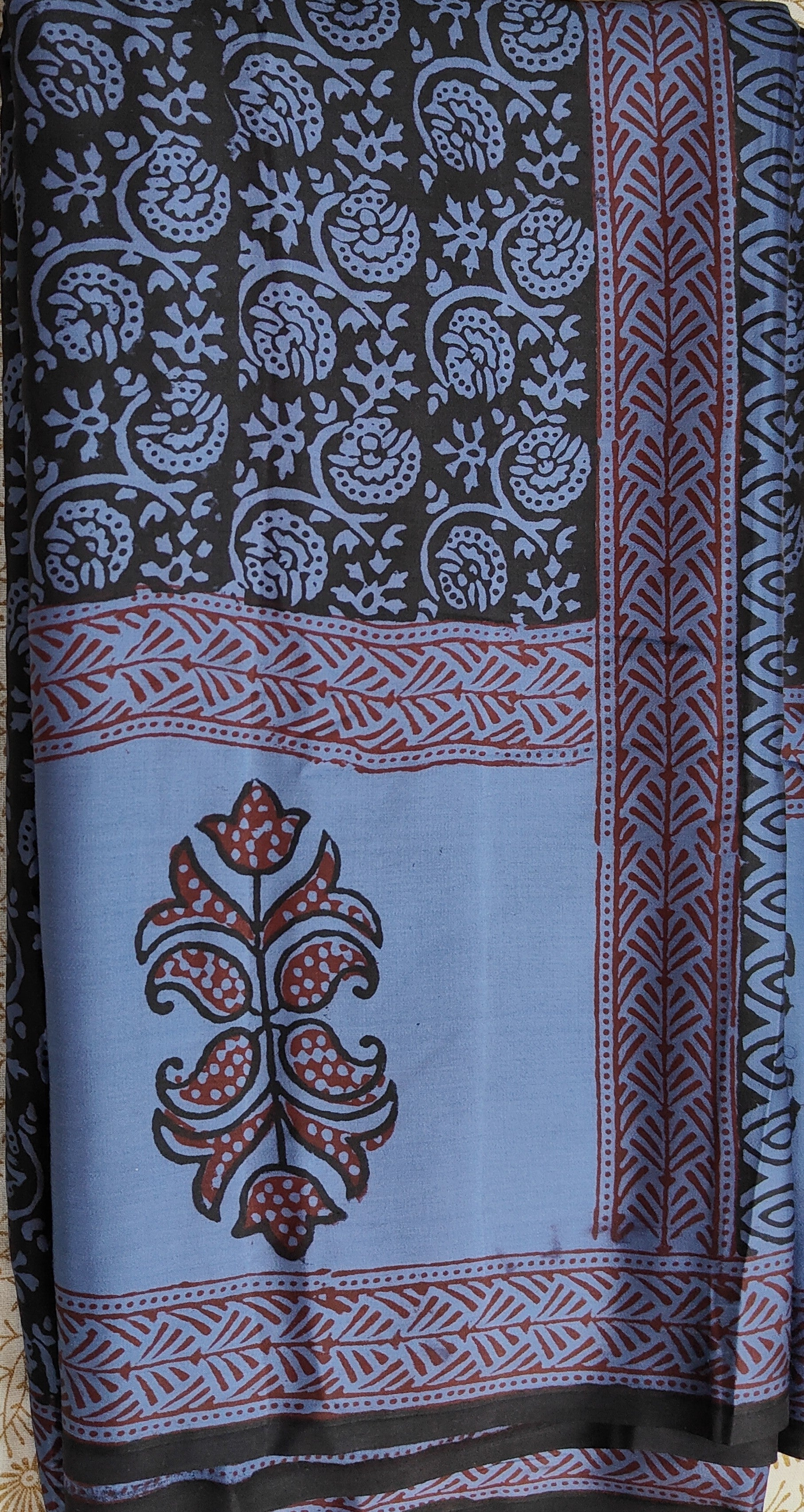 Sustainable luxury Modal silk saree featuring traditional handmade Bagh block prints in rich blue and black