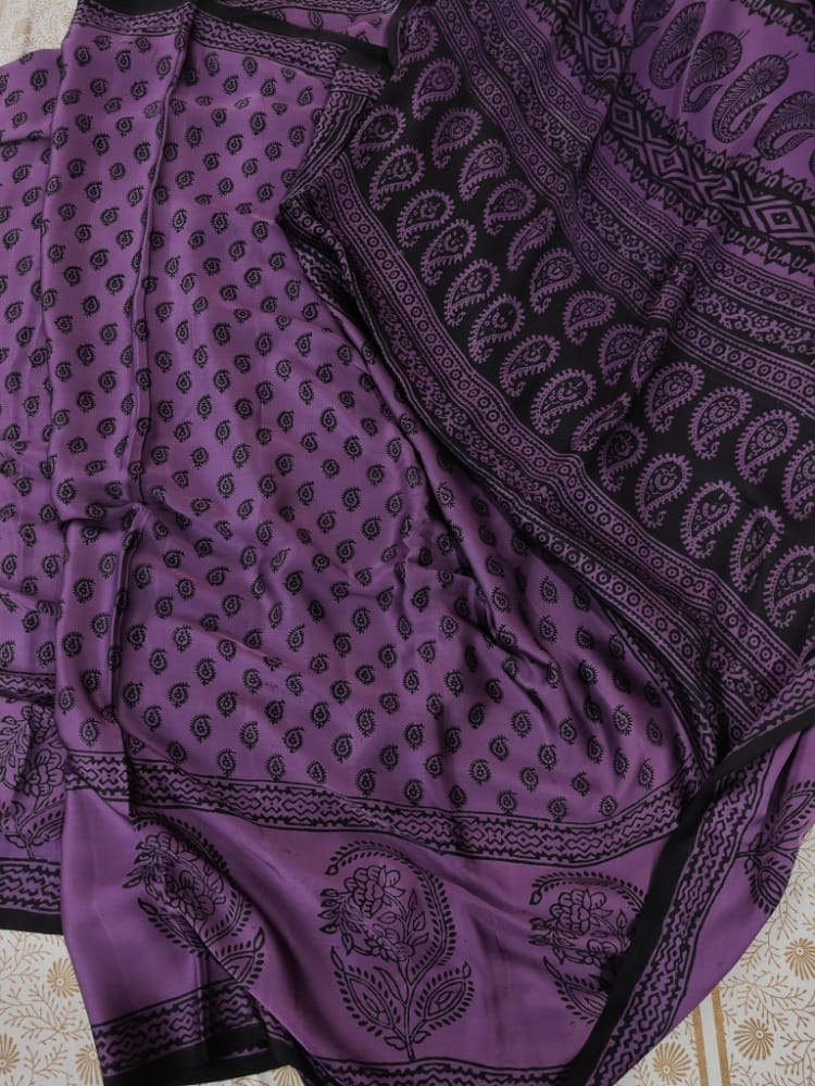 Sustainable luxury Modal silk saree featuring traditional handmade Bagh block prints in rich purple and black