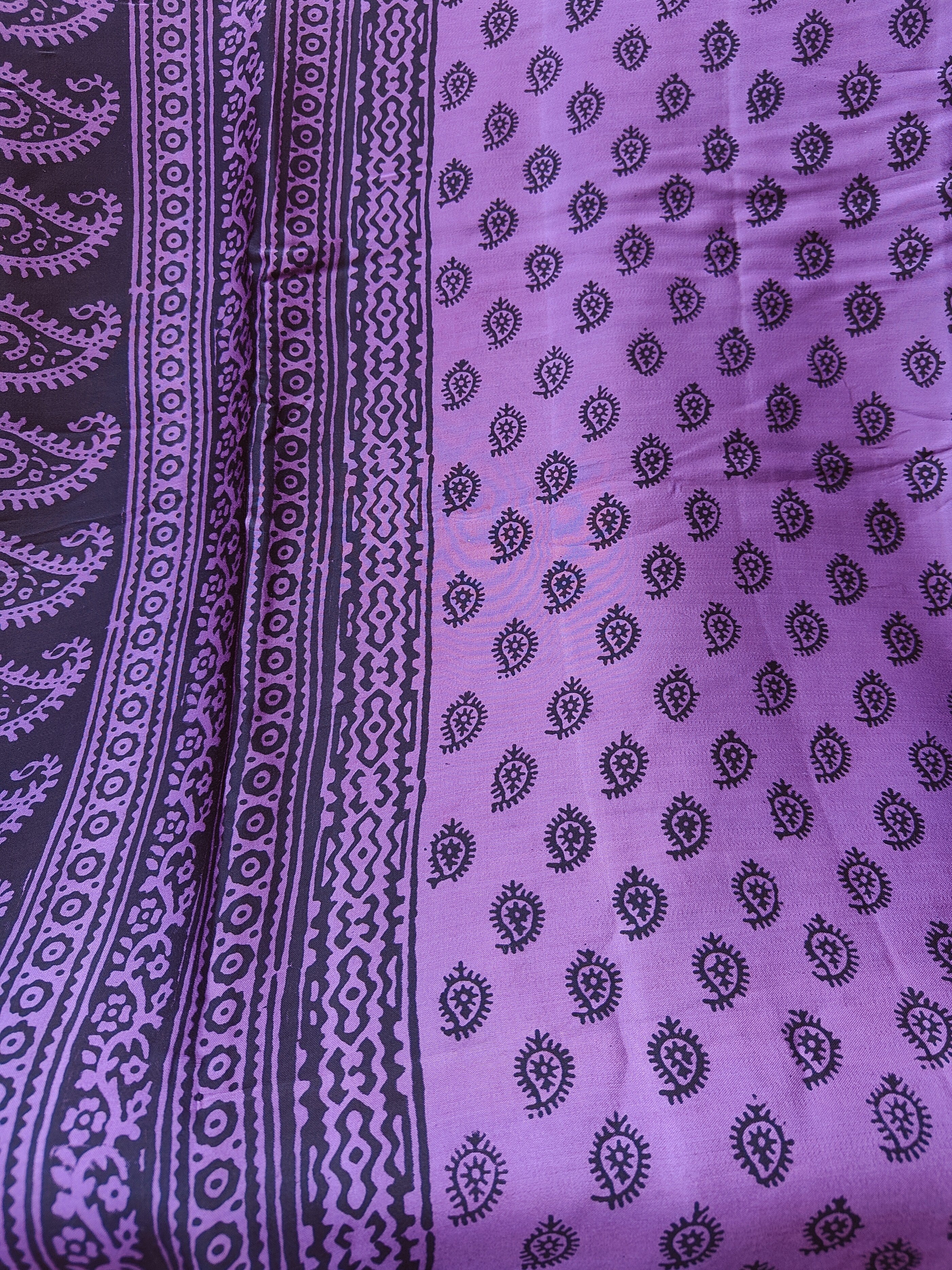 Sustainable luxury Modal silk saree featuring traditional handmade Bagh block prints in rich purple and black