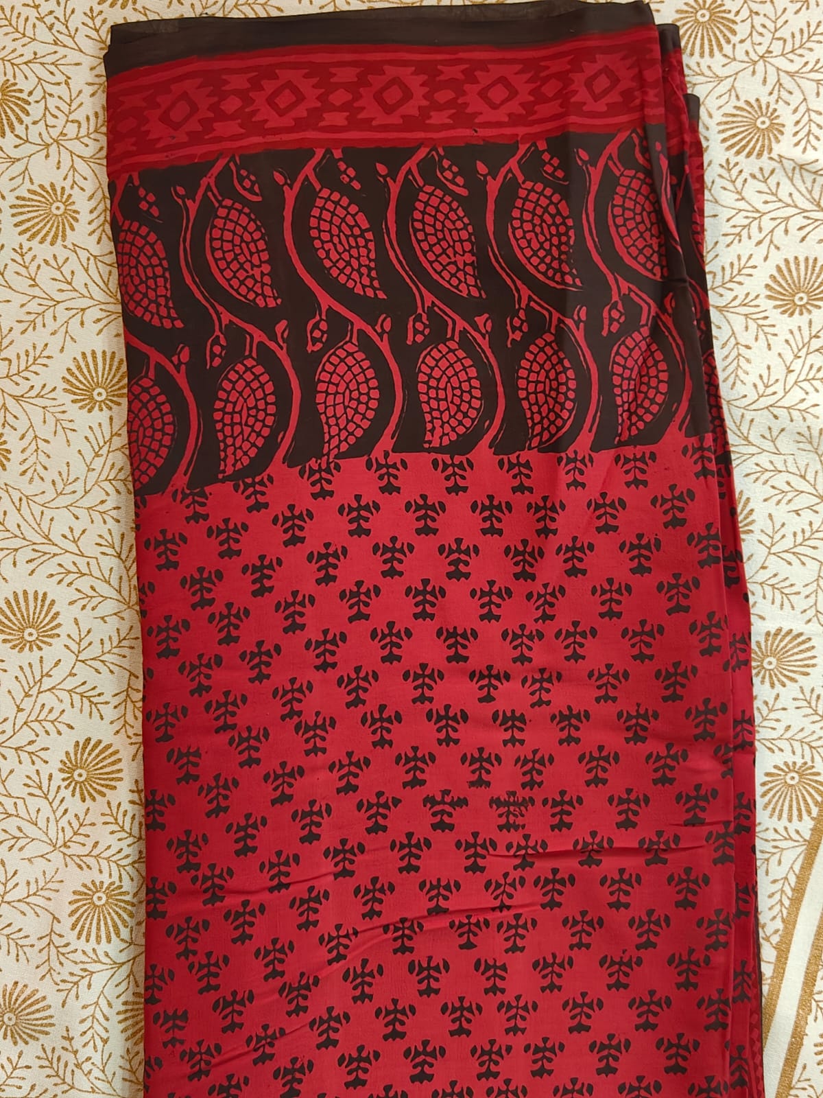 bagh block prints on a Modal silk saree, showcasing traditional Bagh floral motifs on red background