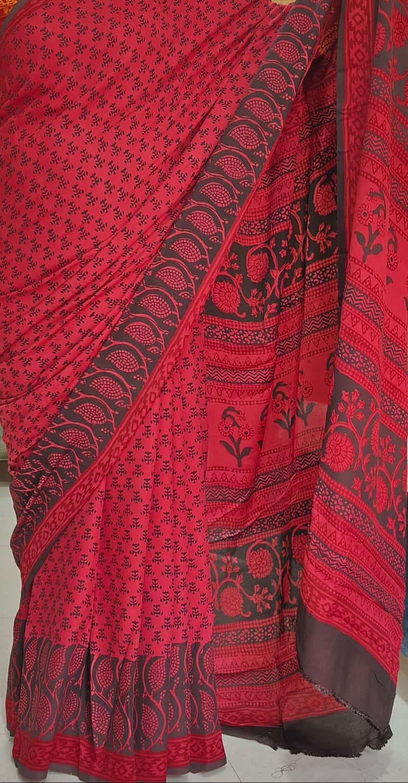 bagh block prints on a Modal silk saree, showcasing traditional Bagh floral motifs on red background