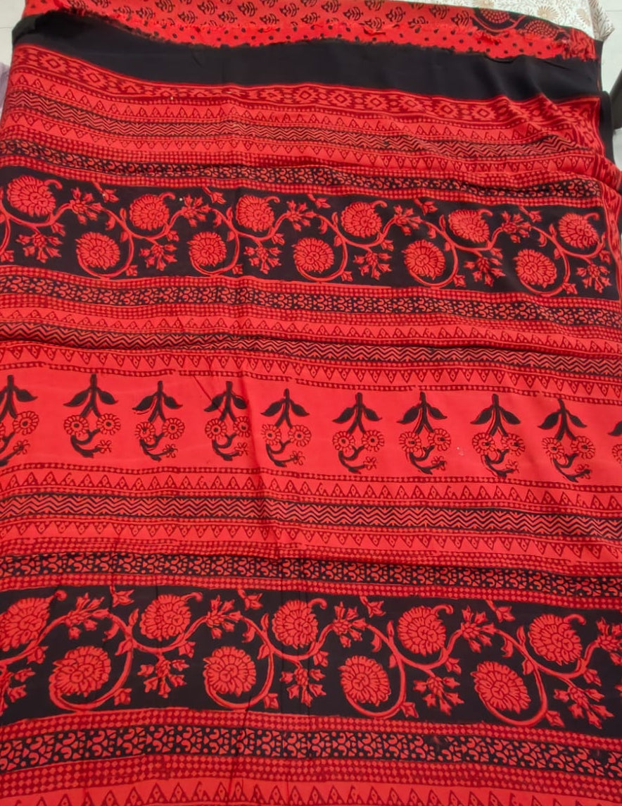 bagh block prints on a Modal silk saree, showcasing traditional Bagh floral motifs on red background