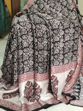 Artisan made wooden block prints on a Modal silk fabric, showcasing traditional Bagh floral motifs in Back and White with red ascent