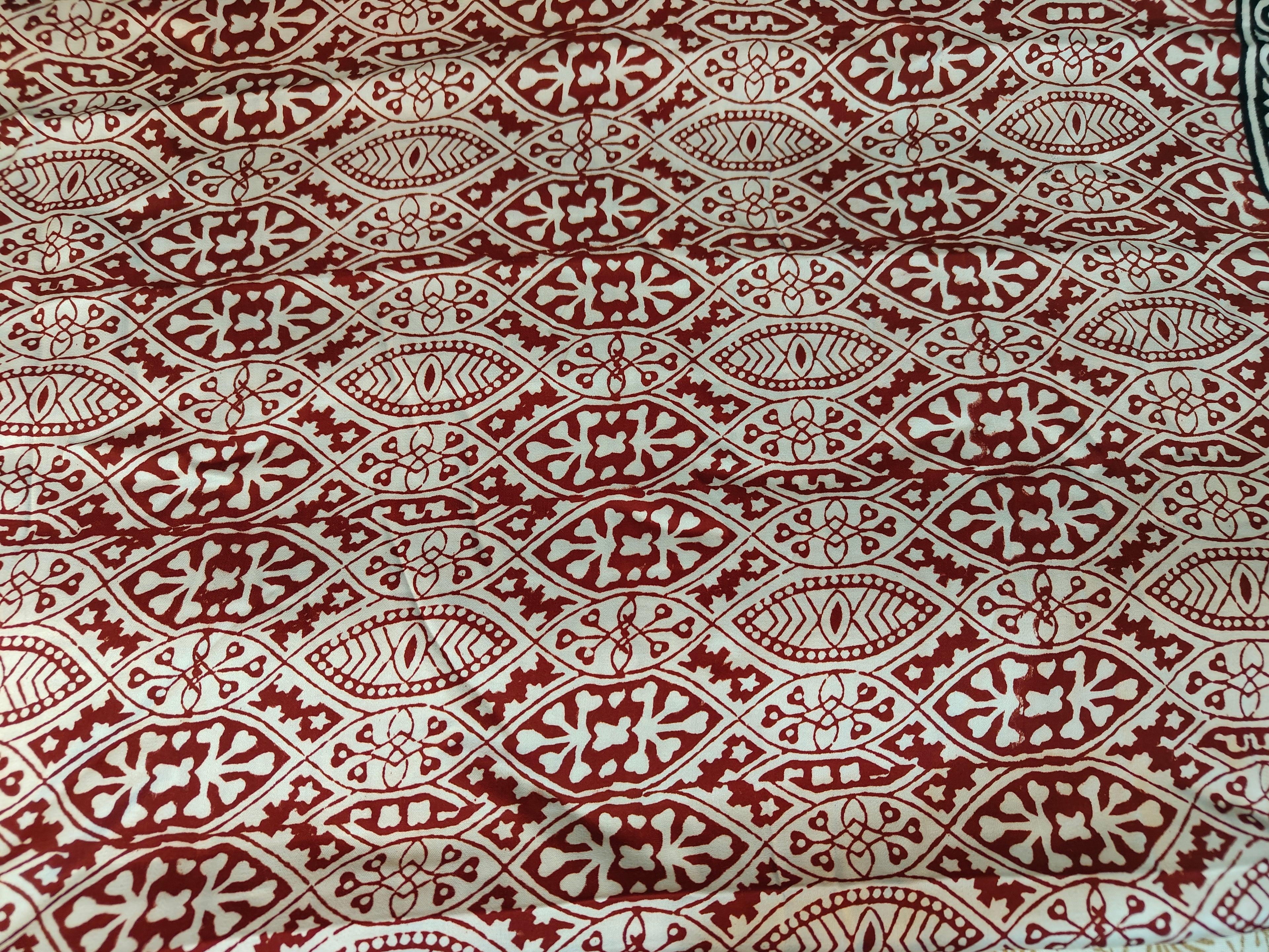 Sustainable luxury silk saree featuring authentic Dhar Bagh print; handmade blocks in rich white and maroon