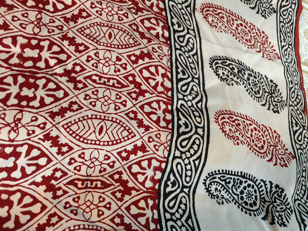 Sustainable luxury silk saree featuring authentic Dhar Bagh print; handmade blocks in rich white and maroon