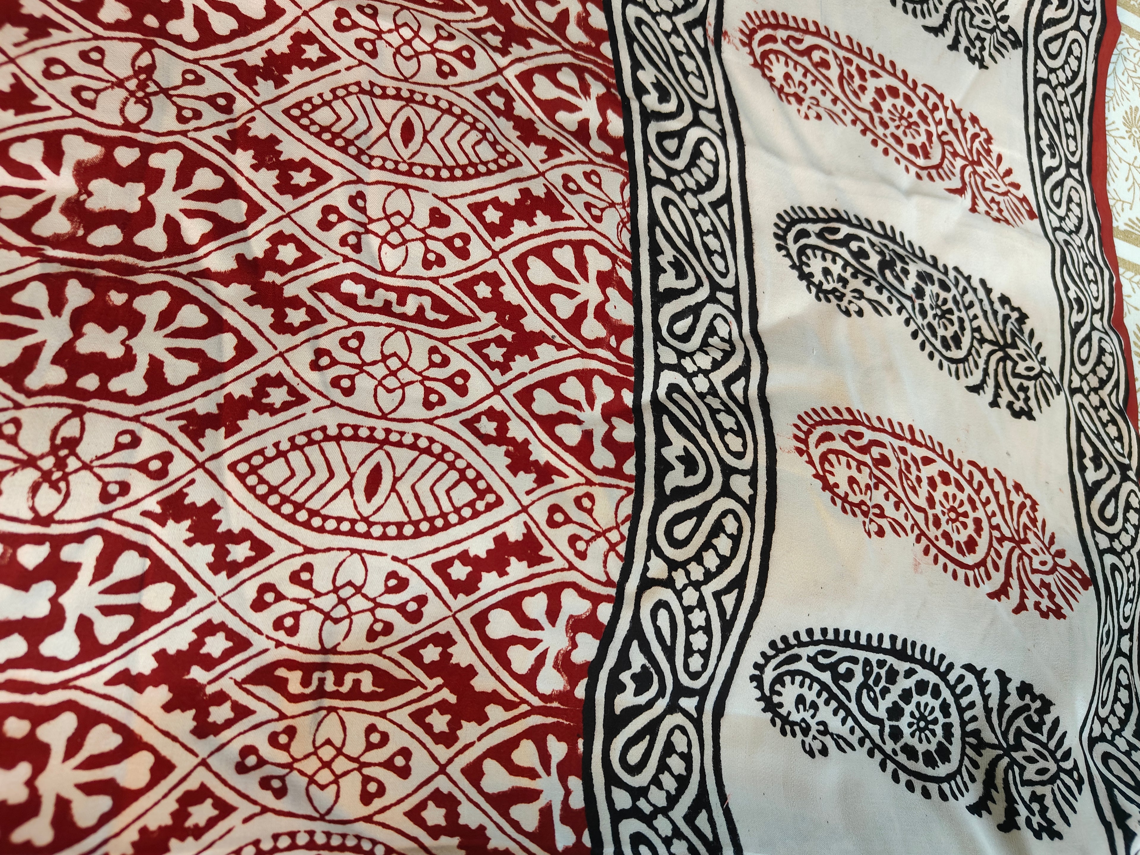 Sustainable luxury silk saree featuring authentic Dhar Bagh print; handmade blocks in rich white and maroon
