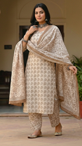 Traditional Dhar Bagh block print on off-white pure cotton fabric; copper-colored handmade big leaf motifs on an unstitched suit set with dupatta