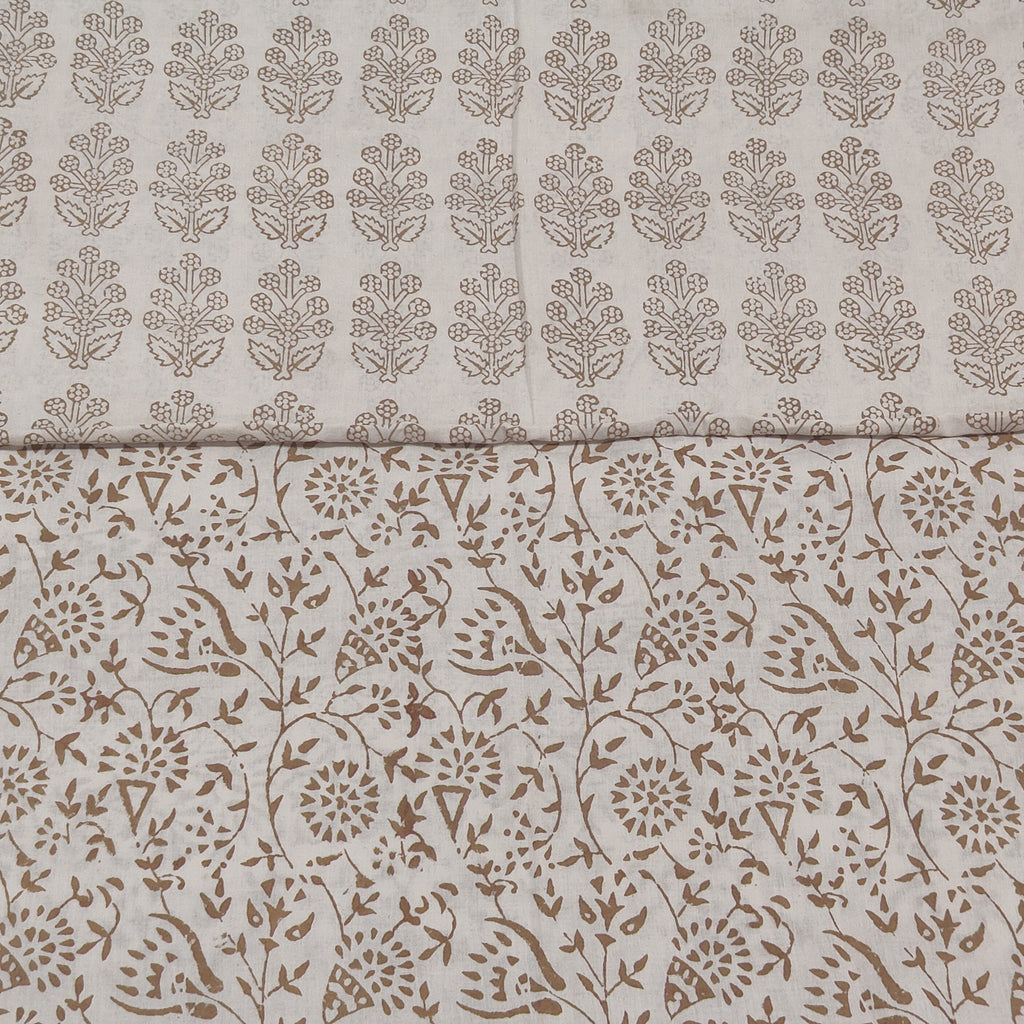Traditional Dhar Bagh block print on off-white pure cotton fabric; copper-colored handmade big leaf motifs on an unstitched suit set with dupatta