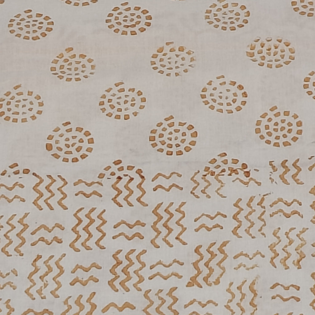 Traditional Dhar Bagh block print on off-white pure cotton fabric; copper-colored handmade circular  copper motifs on an unstitched suit set with dupatta