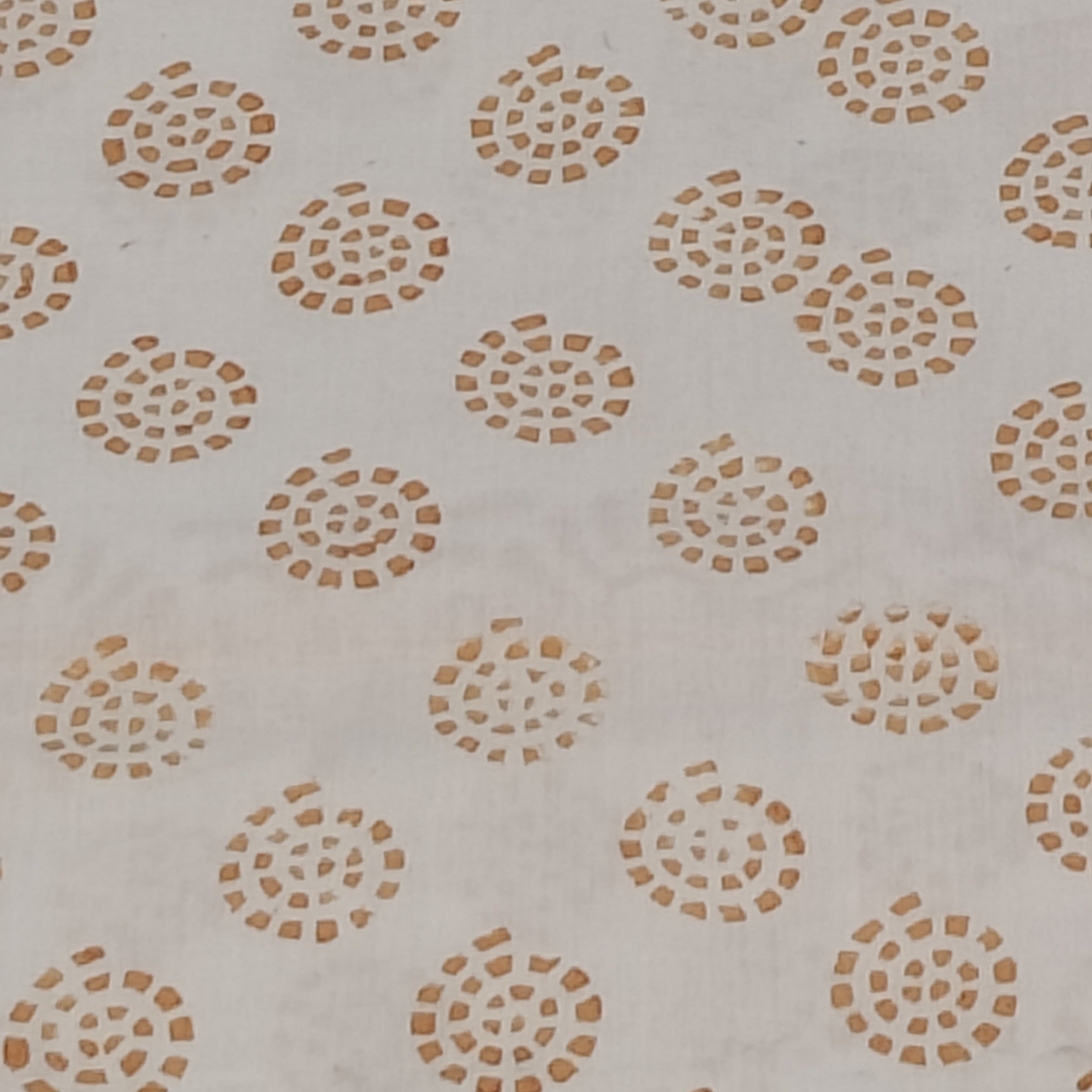 Traditional Dhar Bagh block print on off-white pure cotton fabric; copper-colored handmade circular  motifs on an unstitched suit set with dupatta