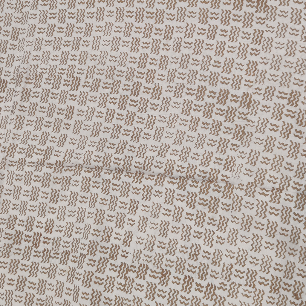 Traditional Dhar Bagh block print on off-white pure cotton fabric; copper-colored handmade circular  motifs on an unstitched suit set with dupatta