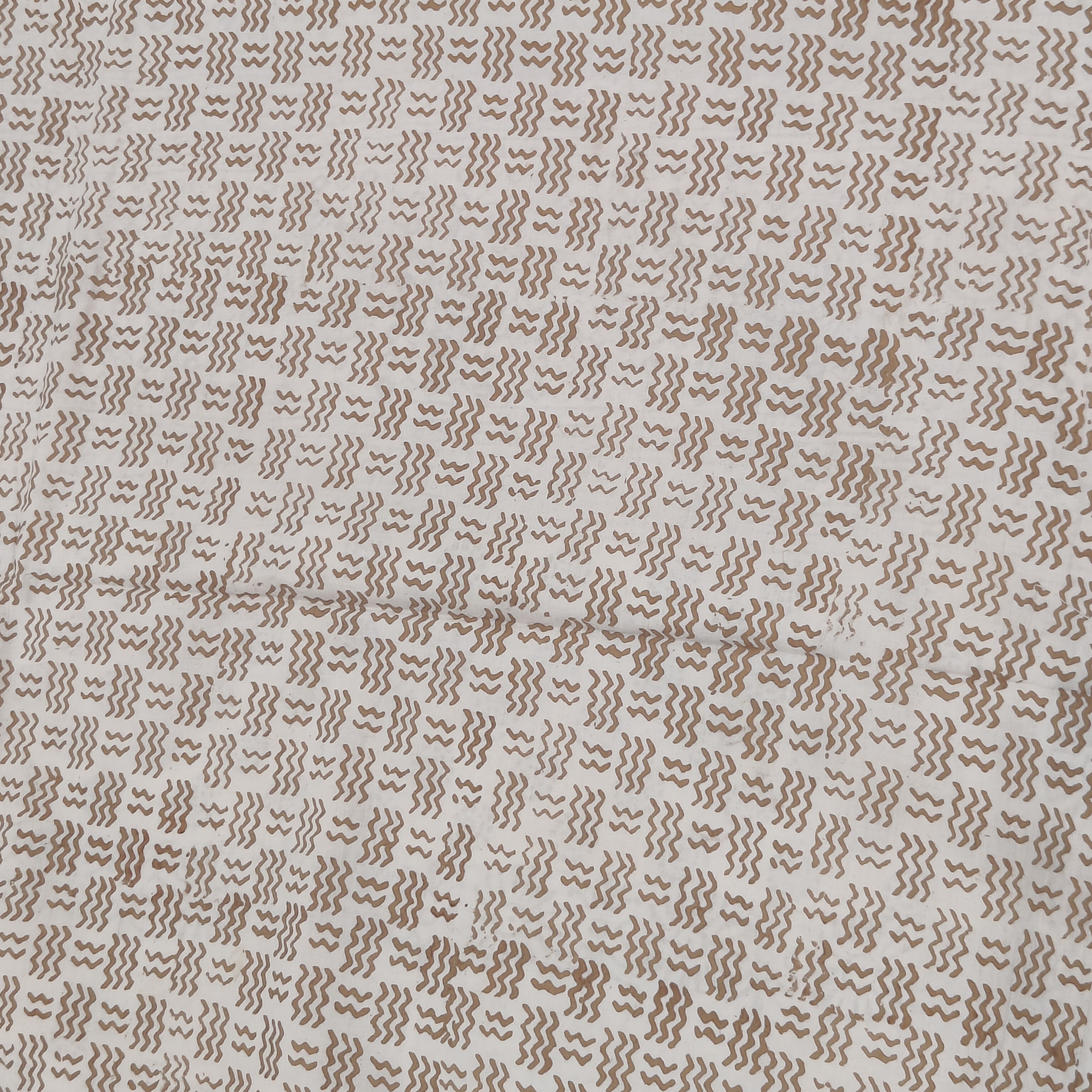 Traditional Dhar Bagh block print on off-white pure cotton fabric; copper-colored handmade circular  motifs on an unstitched suit set with dupatta