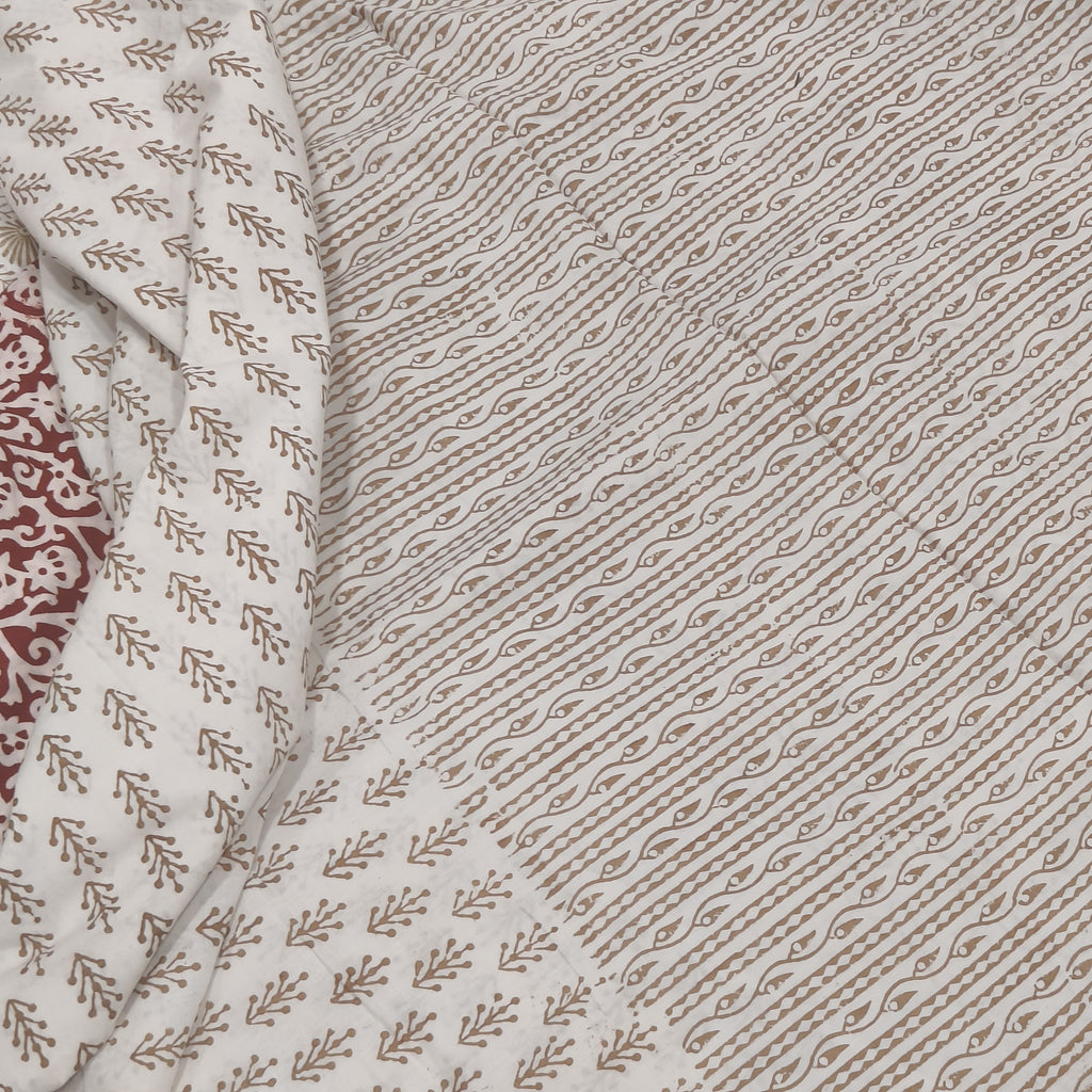 Traditional Dhar Bagh block print on off-white pure cotton fabric; copper-colored handmade big leaf motifs on an unstitched suit set with dupatta