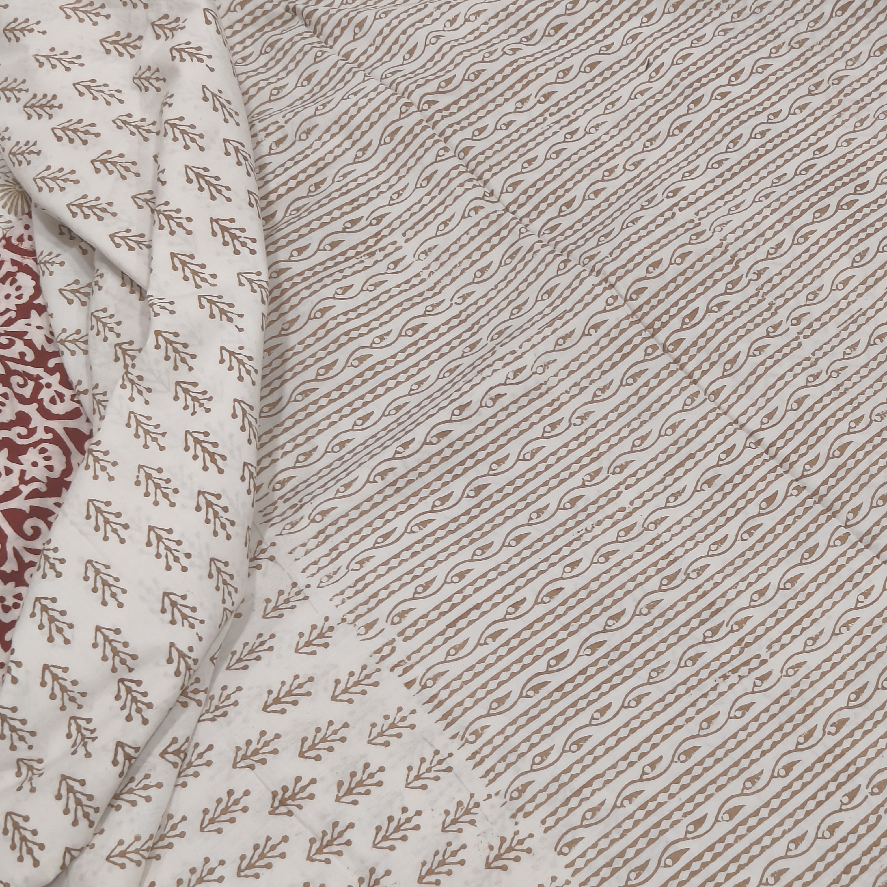 Traditional Dhar Bagh block print on off-white pure cotton fabric; copper-colored handmade big leaf motifs on an unstitched suit set with dupatta