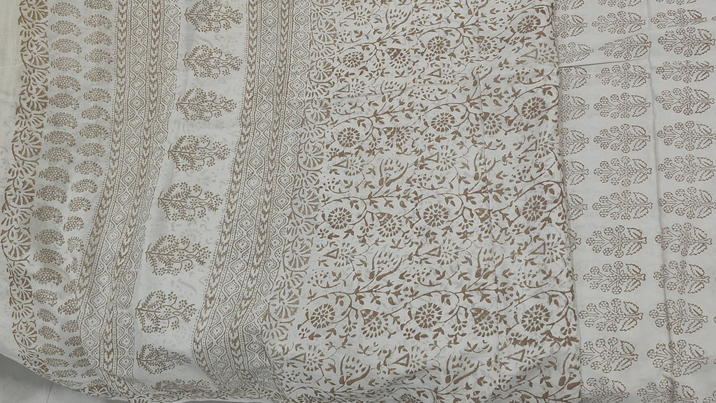 Traditional Dhar Bagh block print on off-white pure cotton fabric; copper-colored handmade big leaf motifs on an unstitched suit set with dupatta
