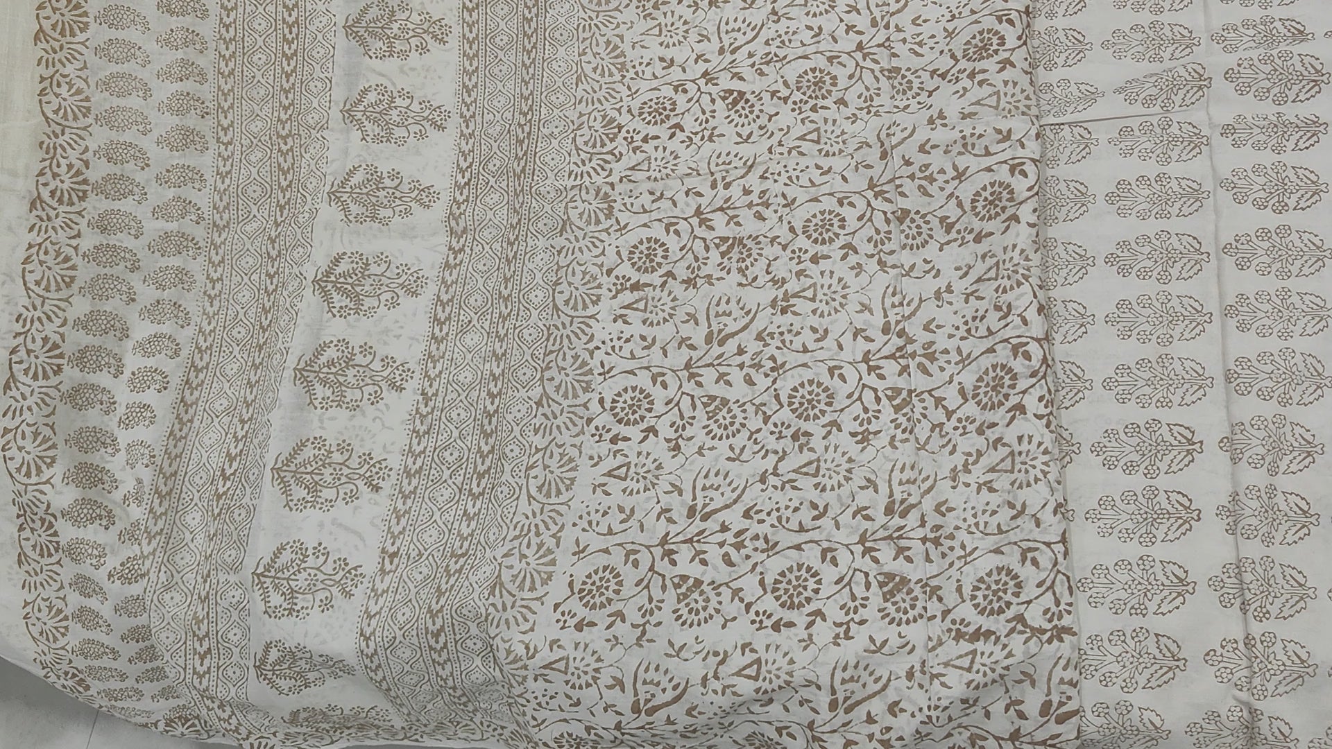 Traditional Dhar Bagh block print on off-white pure cotton fabric; copper-colored handmade big leaf motifs on an unstitched suit set with dupatta