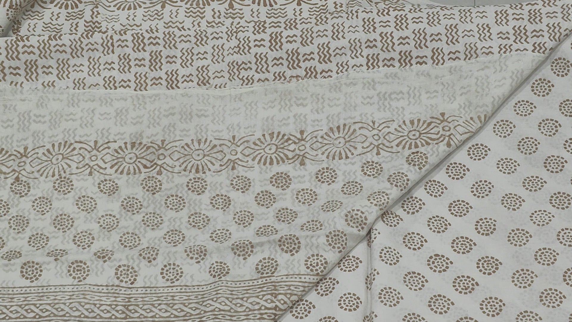 Traditional Dhar Bagh block print on off-white pure cotton fabric; copper-colored handmade big leaf motifs on an unstitched suit set with dupatta