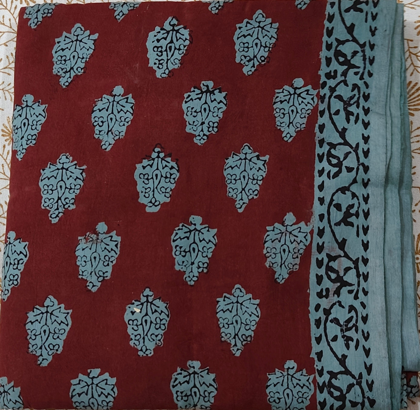 Traditional Dhar Bagh block print on  pure cotton fabric; maroon and green handmade motifs on an unstitched suit set with dupatta
