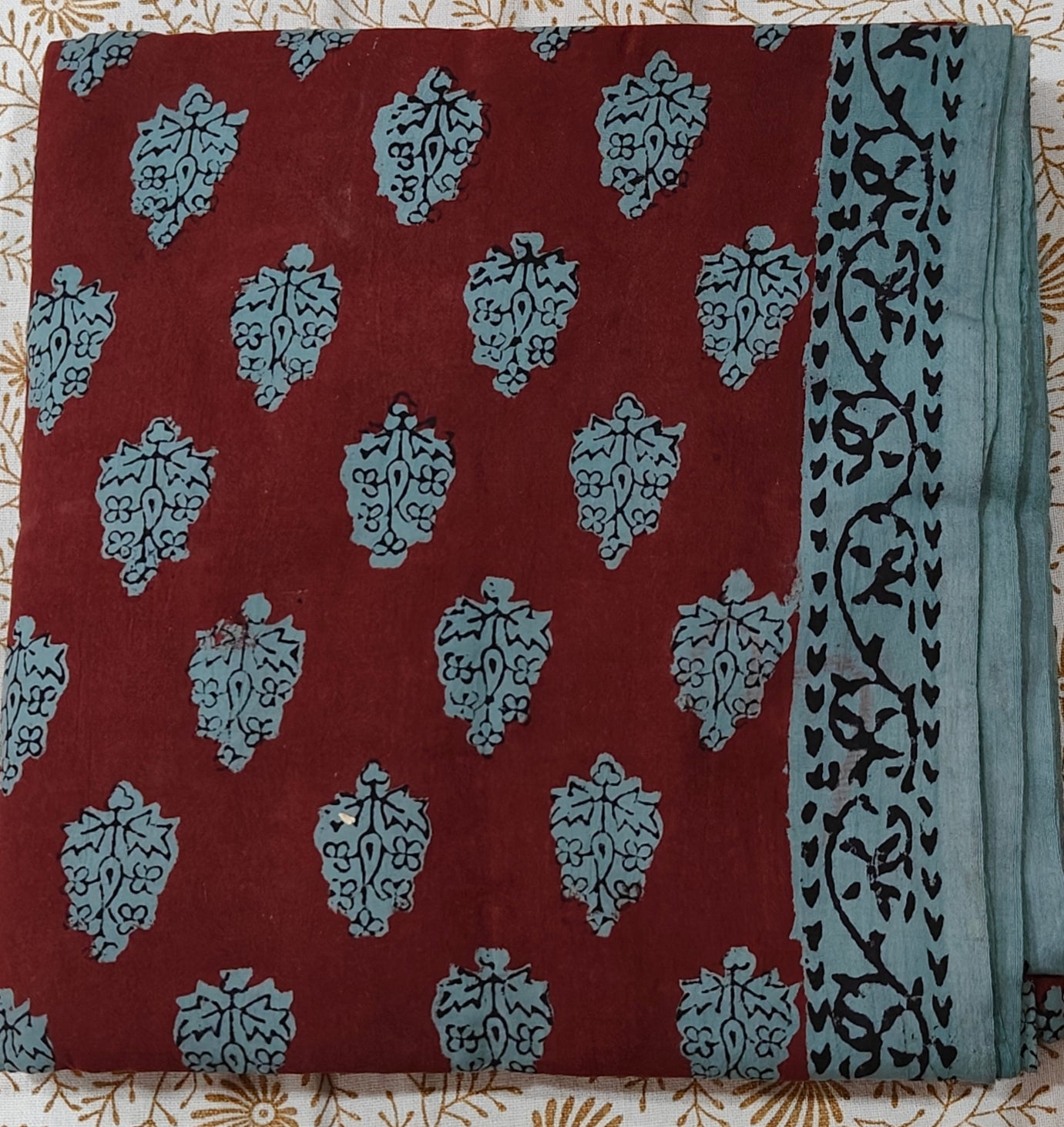 Traditional Dhar Bagh block print on  pure cotton fabric; maroon and green handmade motifs on an unstitched suit set with dupatta