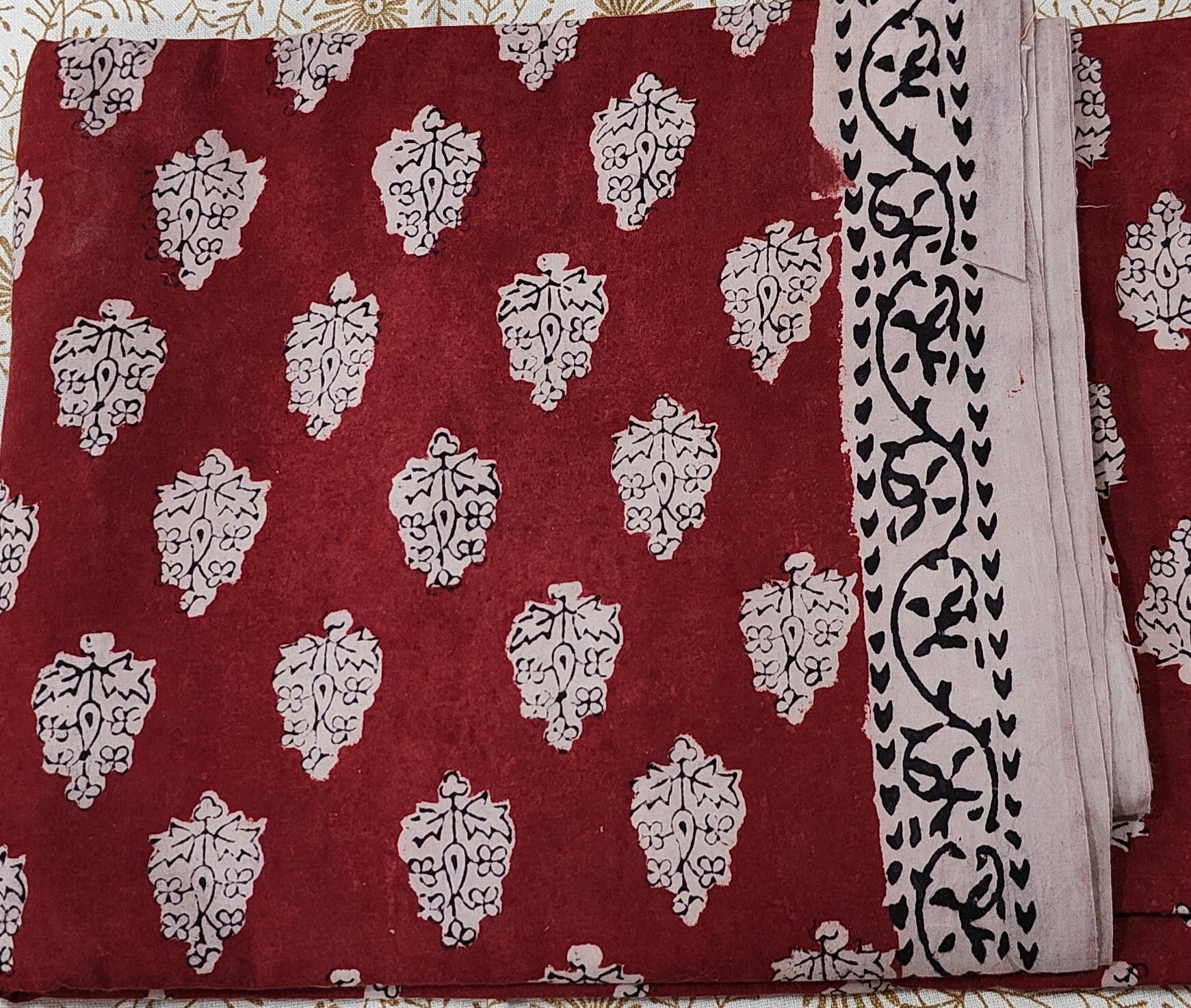 Traditional Dhar Bagh block print on  pure cotton fabric; maroon and white handmade motifs on an unstitched suit set with dupatta