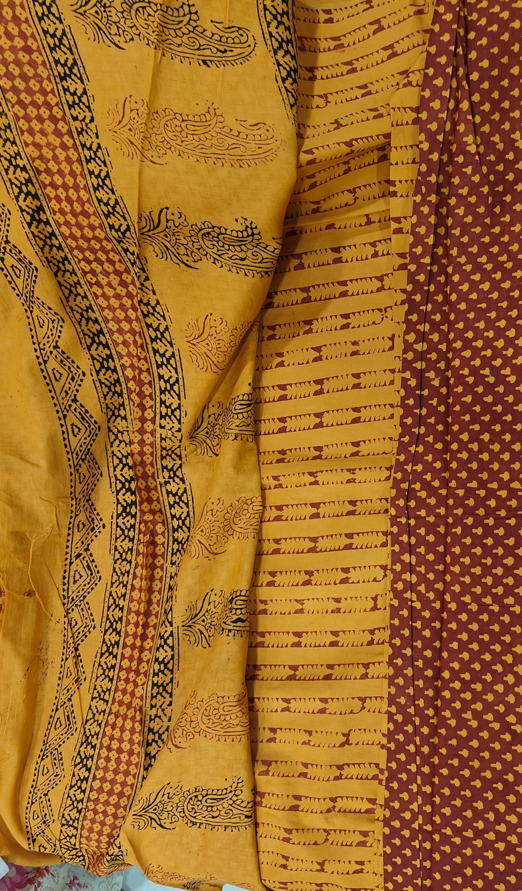 Traditional Dhar Bagh block print on  pure cotton fabric; maroon and mustard yellow handmade small motifs on an unstitched suit set with dupatta