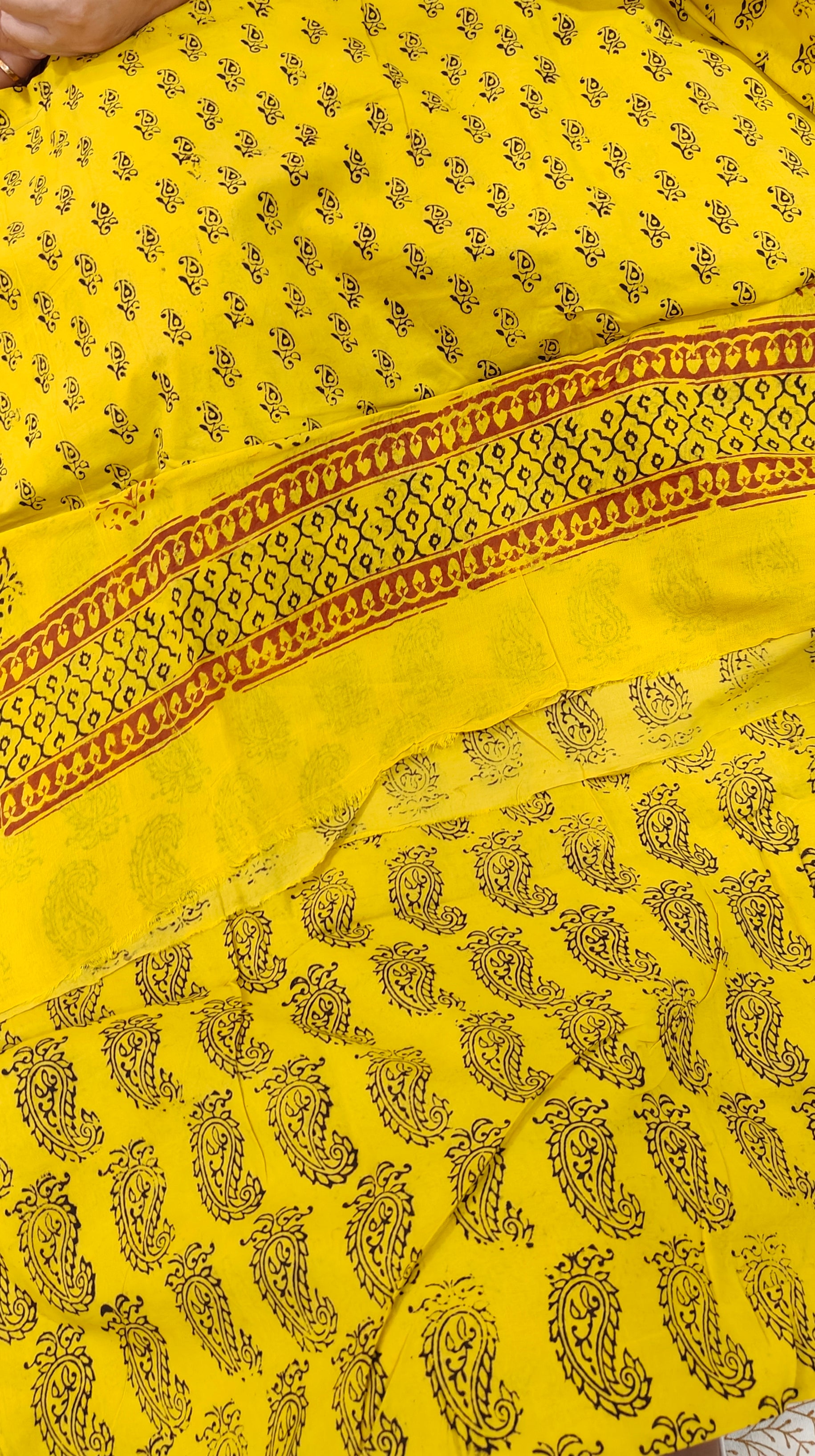 Traditional yellow and maroon Dhar Bagh hand block print unstitched suit set in pure cotton with handmade motifs and matching dupatta.