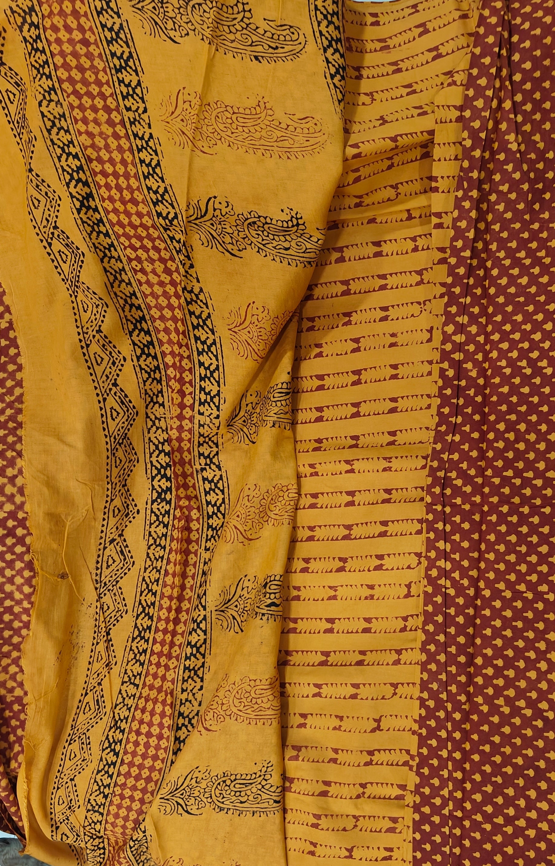 Traditional Dhar Bagh block print on  pure cotton fabric; maroon and mustard yellow handmade small motifs on an unstitched suit set with dupatta