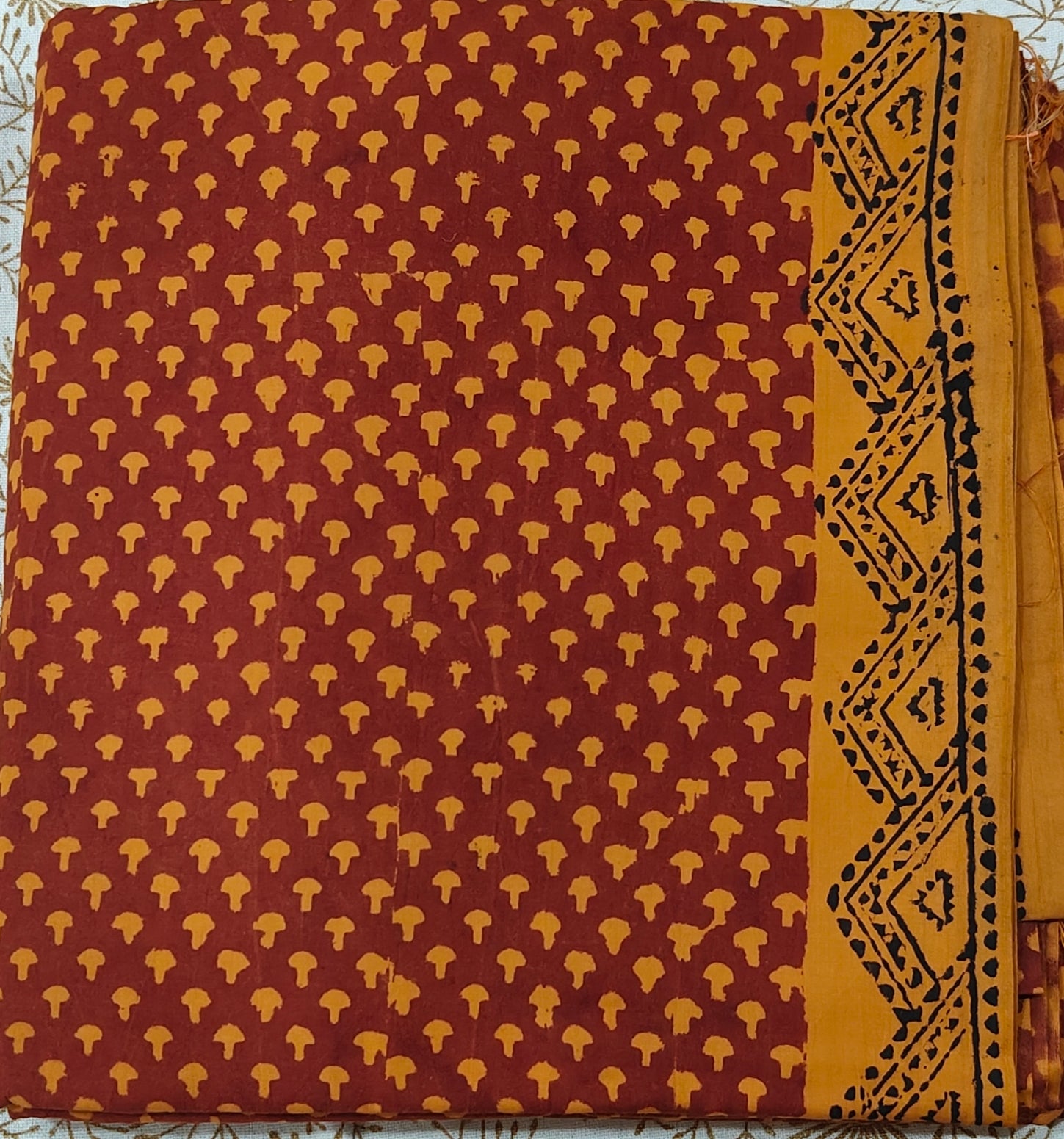 Traditional Dhar Bagh block print on  pure cotton fabric; maroon and mustard yellow handmade small motifs on an unstitched suit set with dupatta