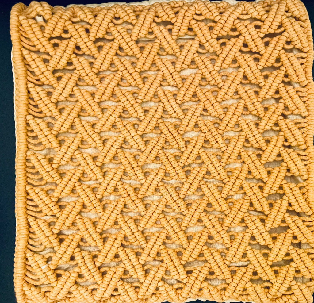 Square macrame cushion cover with intricate knots and , perfect for bohemian living room sofa styling