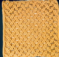 Square macrame cushion cover with intricate knots and , perfect for bohemian living room sofa styling