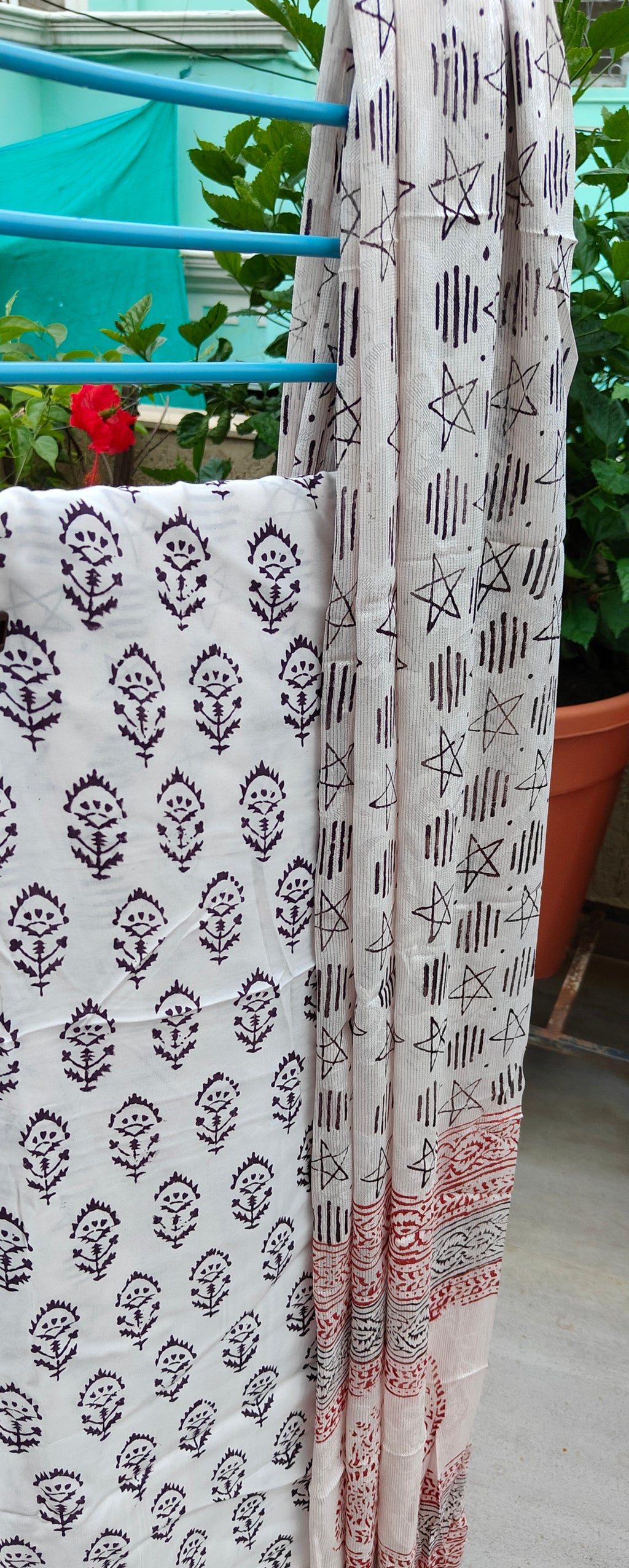 Authentic Dhar Bagh black block print on fine white muslin unstitched suit with a coordinating chiffon dupatta.