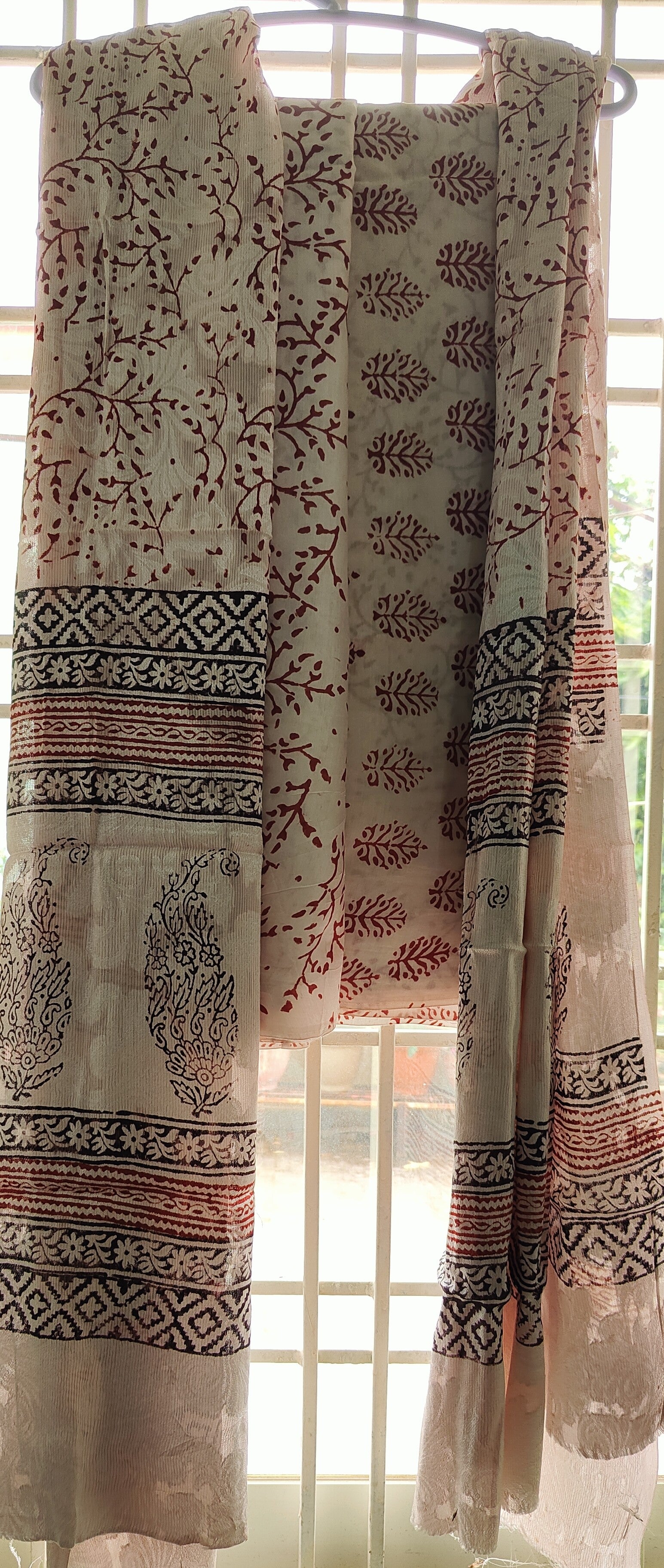 Authentic Dhar Bagh block maroon print on fine white muslin unstitched suit with a coordinating chiffon dupatta.