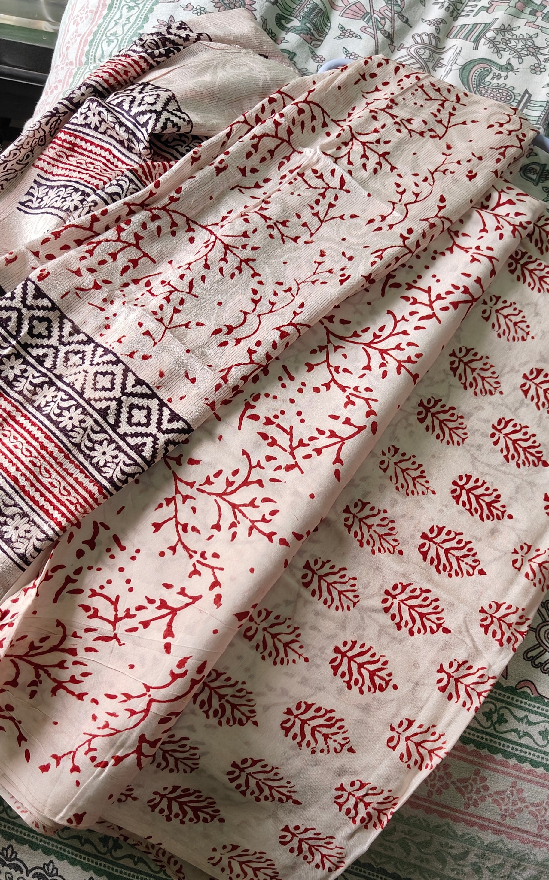 Authentic Dhar Bagh maroon block print on fine white muslin unstitched suit with a coordinating chiffon dupatta.